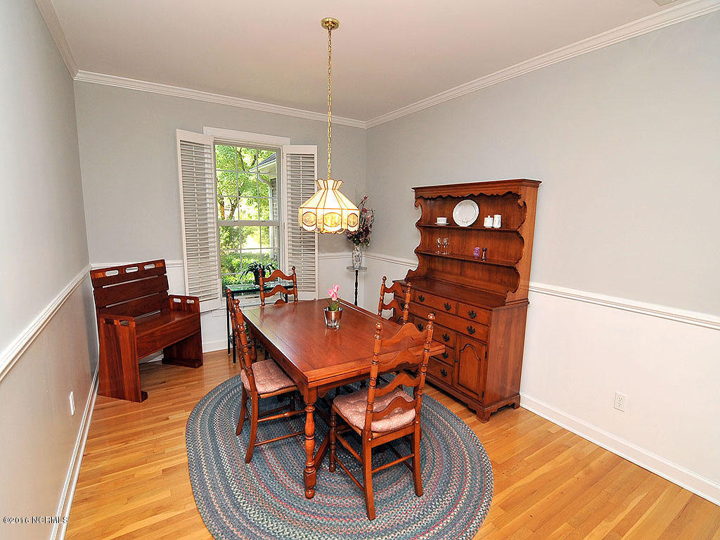 602 Hughes Road Hampstead, NC 28443 - Photo 16 of 31 This dining room offers latest paint colors, glowing wood floors.