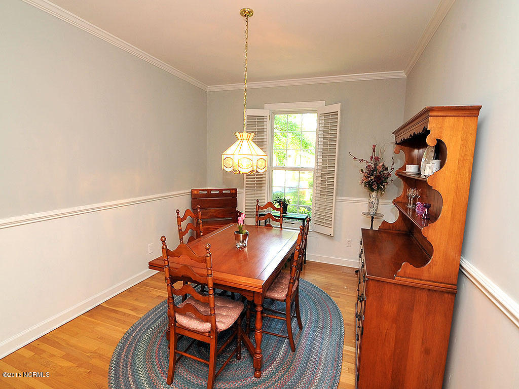 602 Hughes Road Hampstead, NC 28443 - Photo 17 of 31 Crown molding and chair rail, showcase the newly painted walls