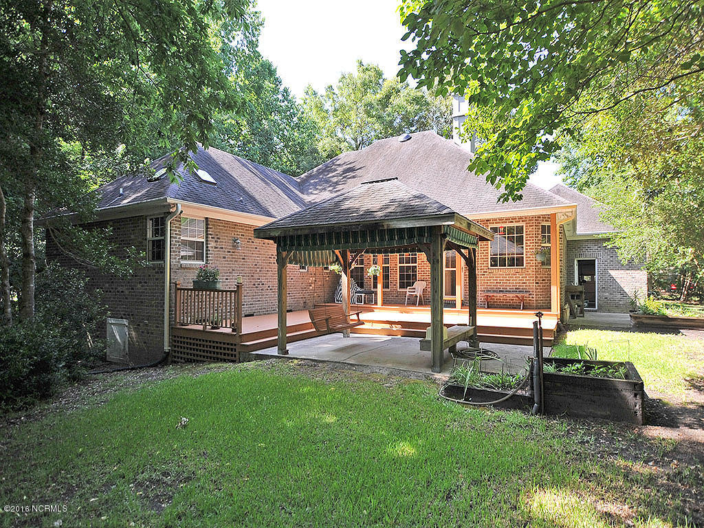 602 Hughes Road Hampstead, NC 28443 - Photo 3 of 31 Fantastic backyard with natural privacy boarder and plenty of room to enjoy with Family.