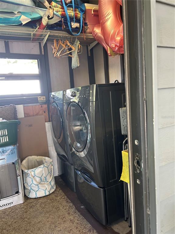 12501 Ulmerton Road, Unit 216 Largo, FL 33774 - Photo 11 of 34 a utility room with dryer and washer