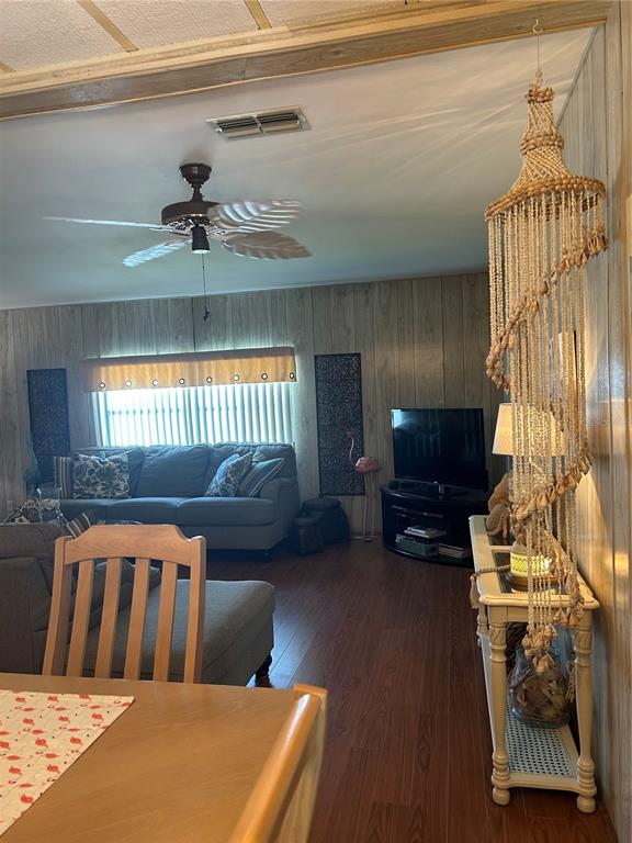 12501 Ulmerton Road, Unit 216 Largo, FL 33774 - Photo 20 of 34 a bedroom with furniture and a wooden floor