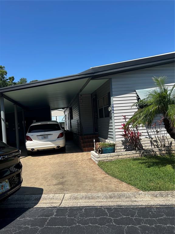 12501 Ulmerton Road, Unit 216 Largo, FL 33774 - Photo 2 of 34 a front view of a house with a yard