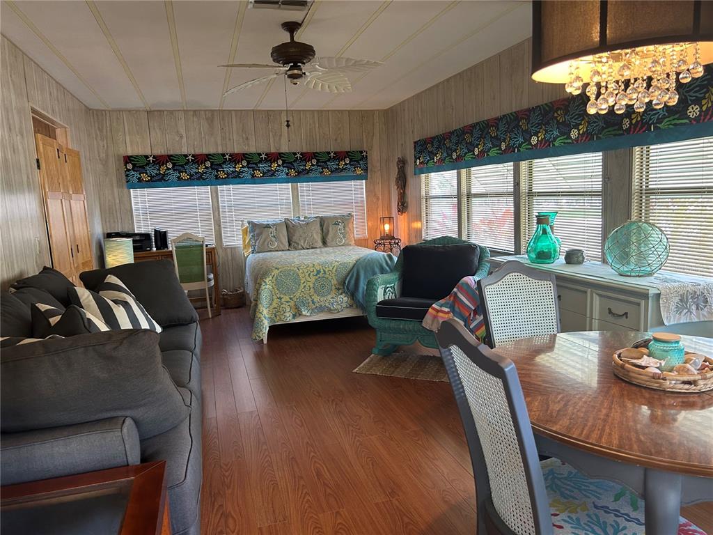 12501 Ulmerton Road, Unit 216 Largo, FL 33774 - Photo 21 of 34 a living room with furniture fireplace and large windows