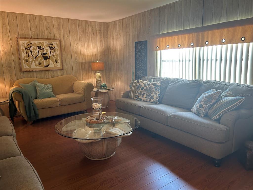 12501 Ulmerton Road, Unit 216 Largo, FL 33774 - Photo 22 of 34 a living room with furniture and a table