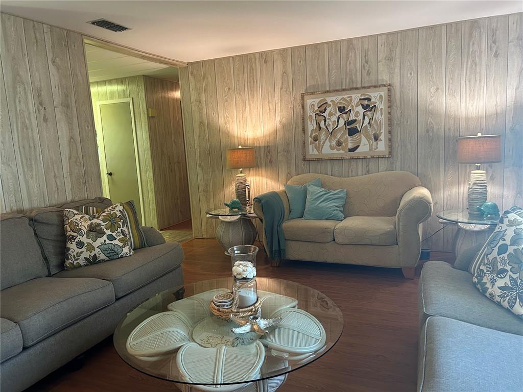 12501 Ulmerton Road, Unit 216 Largo, FL 33774 - Photo 24 of 34 a living room with furniture and a dining table