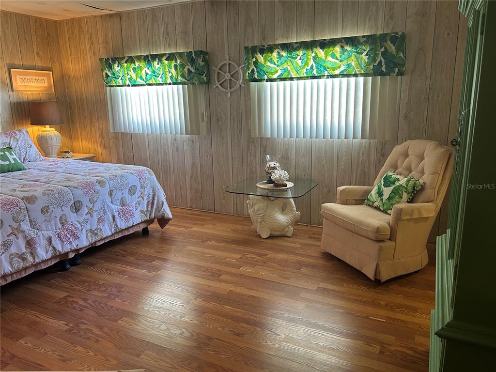 12501 Ulmerton Road, Unit 216 Largo, FL 33774 - Photo 26 of 34 a bedroom with a bed and a couch