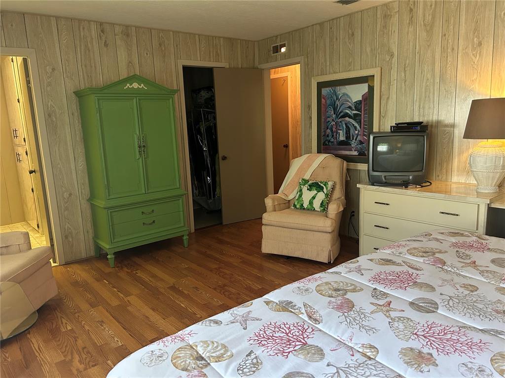 12501 Ulmerton Road, Unit 216 Largo, FL 33774 - Photo 28 of 34 a bedroom with a bed and a couch