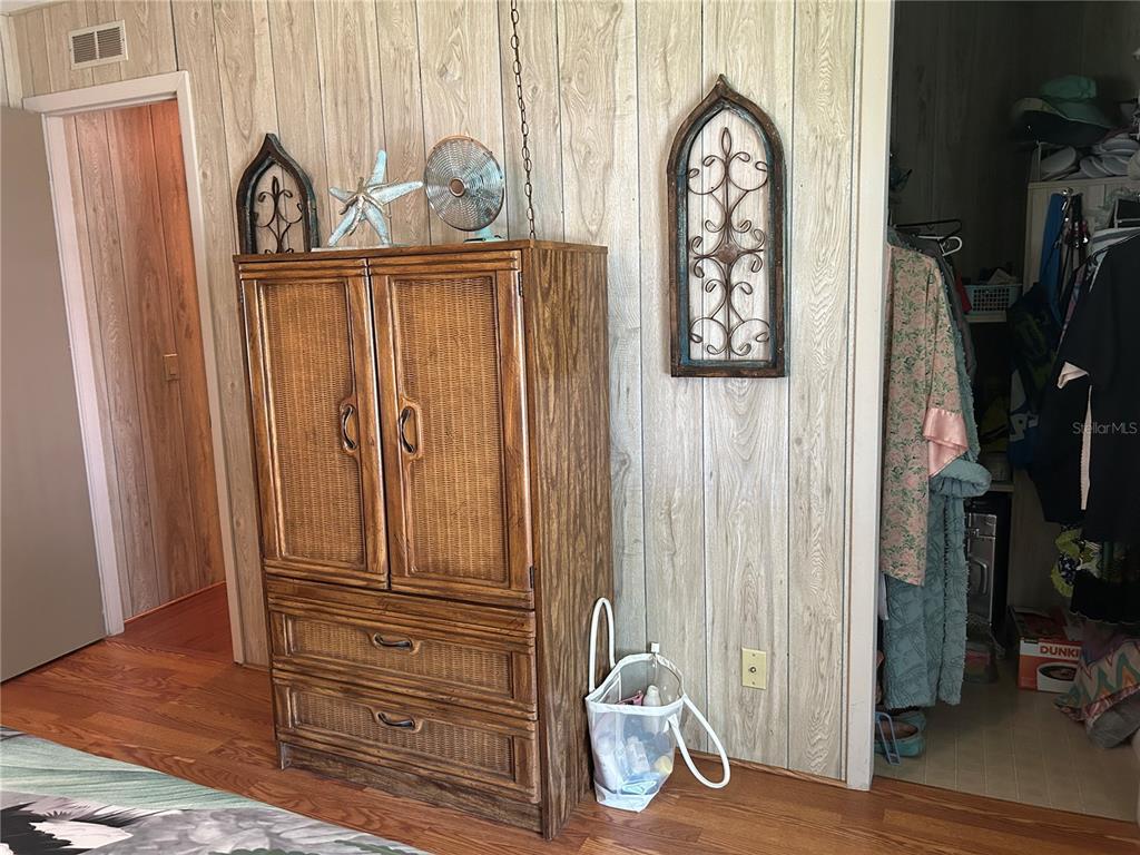12501 Ulmerton Road, Unit 216 Largo, FL 33774 - Photo 30 of 34 a view of walk in closet with clothes and shoes
