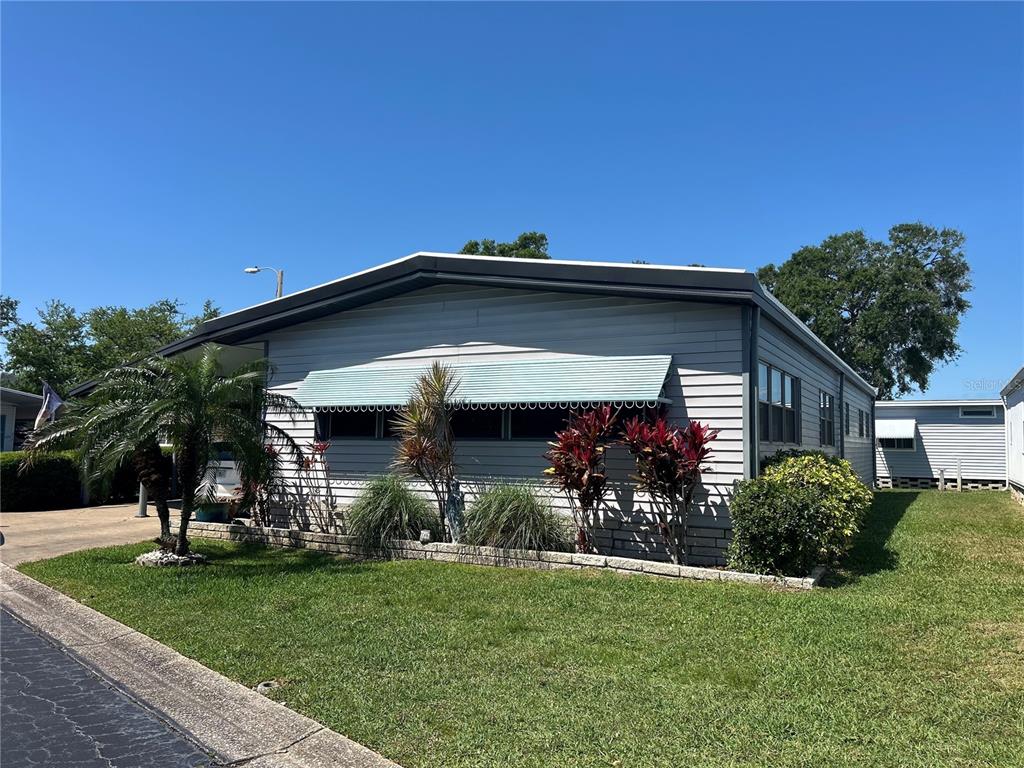 12501 Ulmerton Road, Unit 216 Largo, FL 33774 - Photo 34 of 34 a view of a porch with a yard