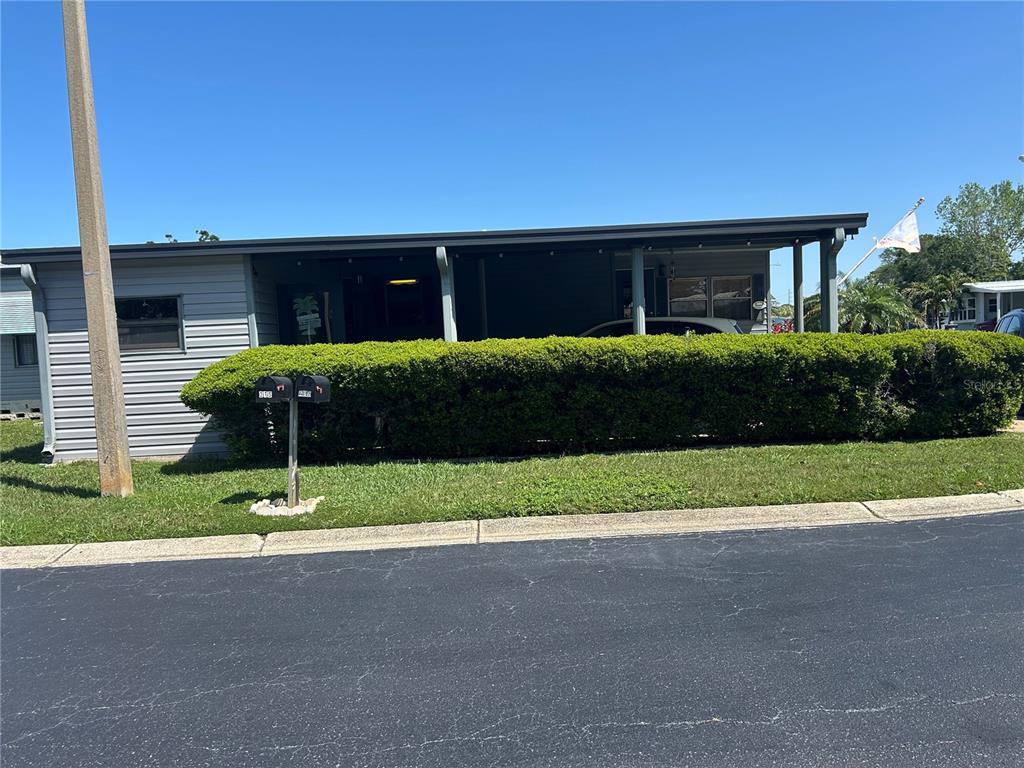 12501 Ulmerton Road, Unit 216 Largo, FL 33774 - Photo 4 of 34 a front view of a house with a yard