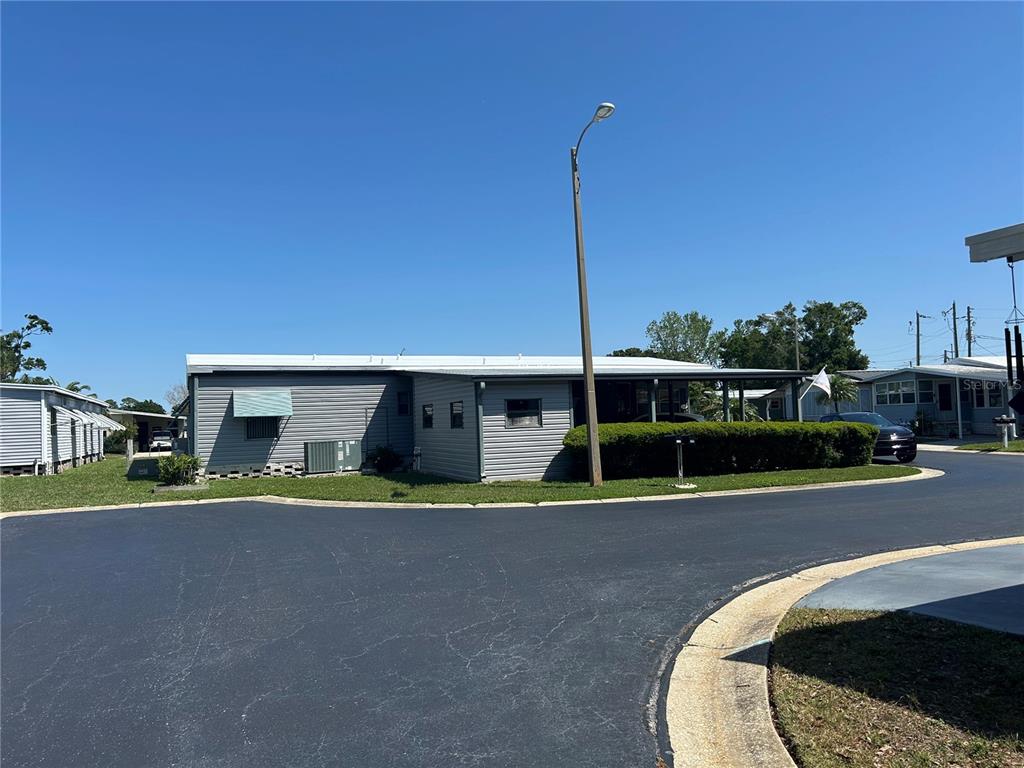 12501 Ulmerton Road, Unit 216 Largo, FL 33774 - Photo 5 of 34 a view of a house with a park and plants