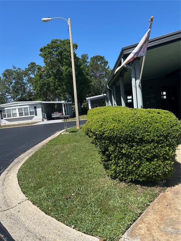 12501 Ulmerton Road, Unit 216 Largo, FL 33774 - Photo 6 of 34 a view of a house with a small yard