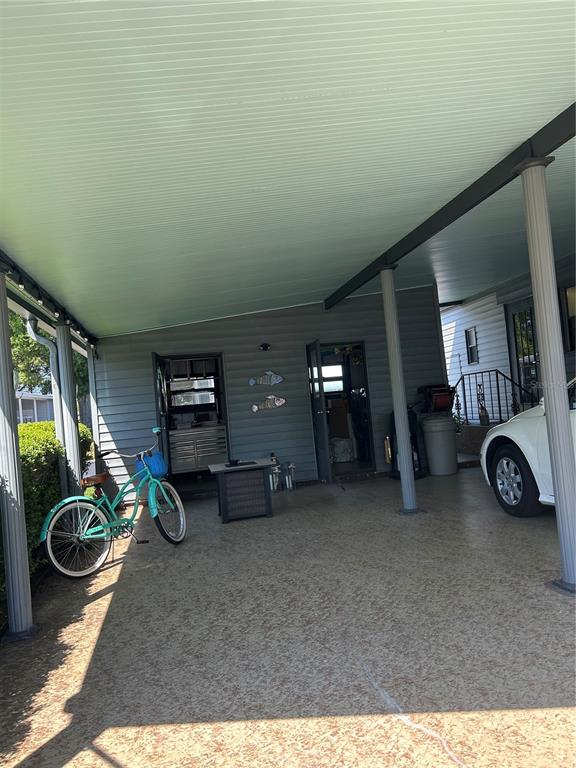 12501 Ulmerton Road, Unit 216 Largo, FL 33774 - Photo 8 of 34 a view of a livingroom with furniture and a tv