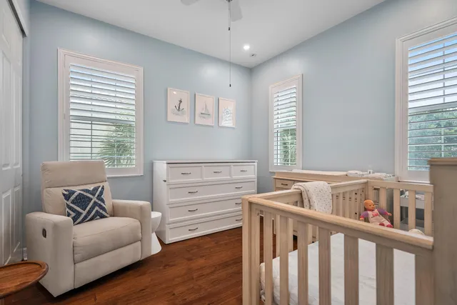 a bedroom with furniture and a window