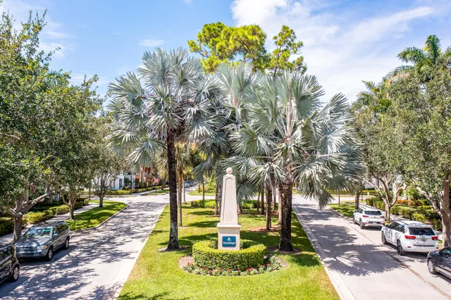 an aerial view of residential house with outdoor space and trees all around