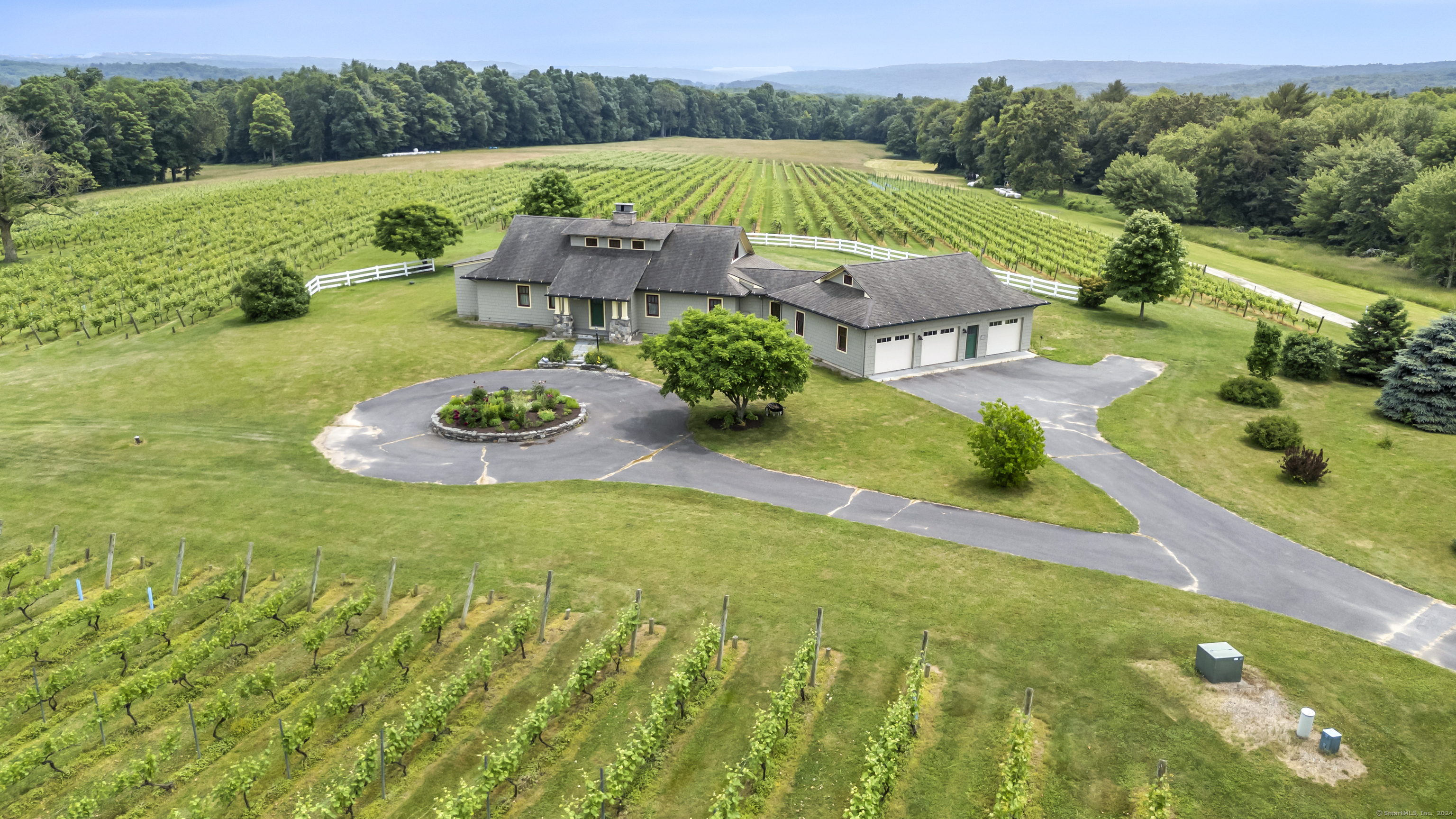 an aerial view of a house with garden space and street view