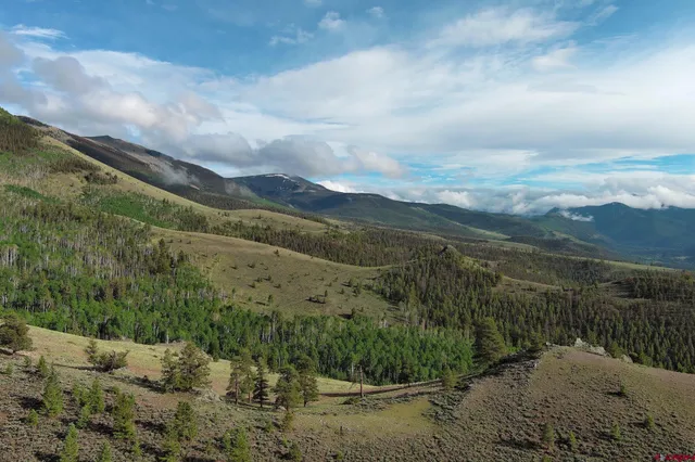 a view of a town with mountains in the background