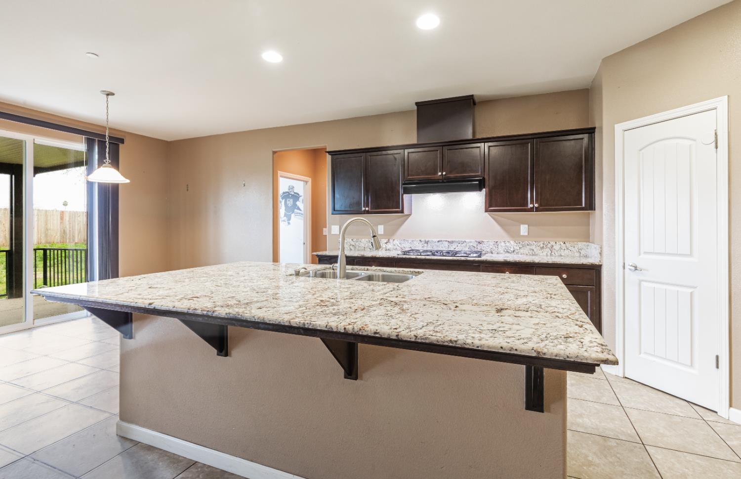 863 Legacy Drive Lemoore, CA 93245 - Photo 12 of 33 a bathroom with a granite countertop sink and a mirror
