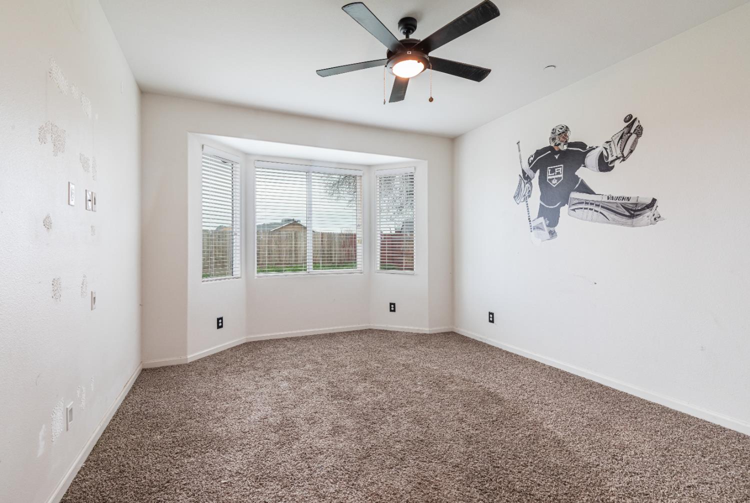 863 Legacy Drive Lemoore, CA 93245 - Photo 18 of 33 a view of an empty room with a window