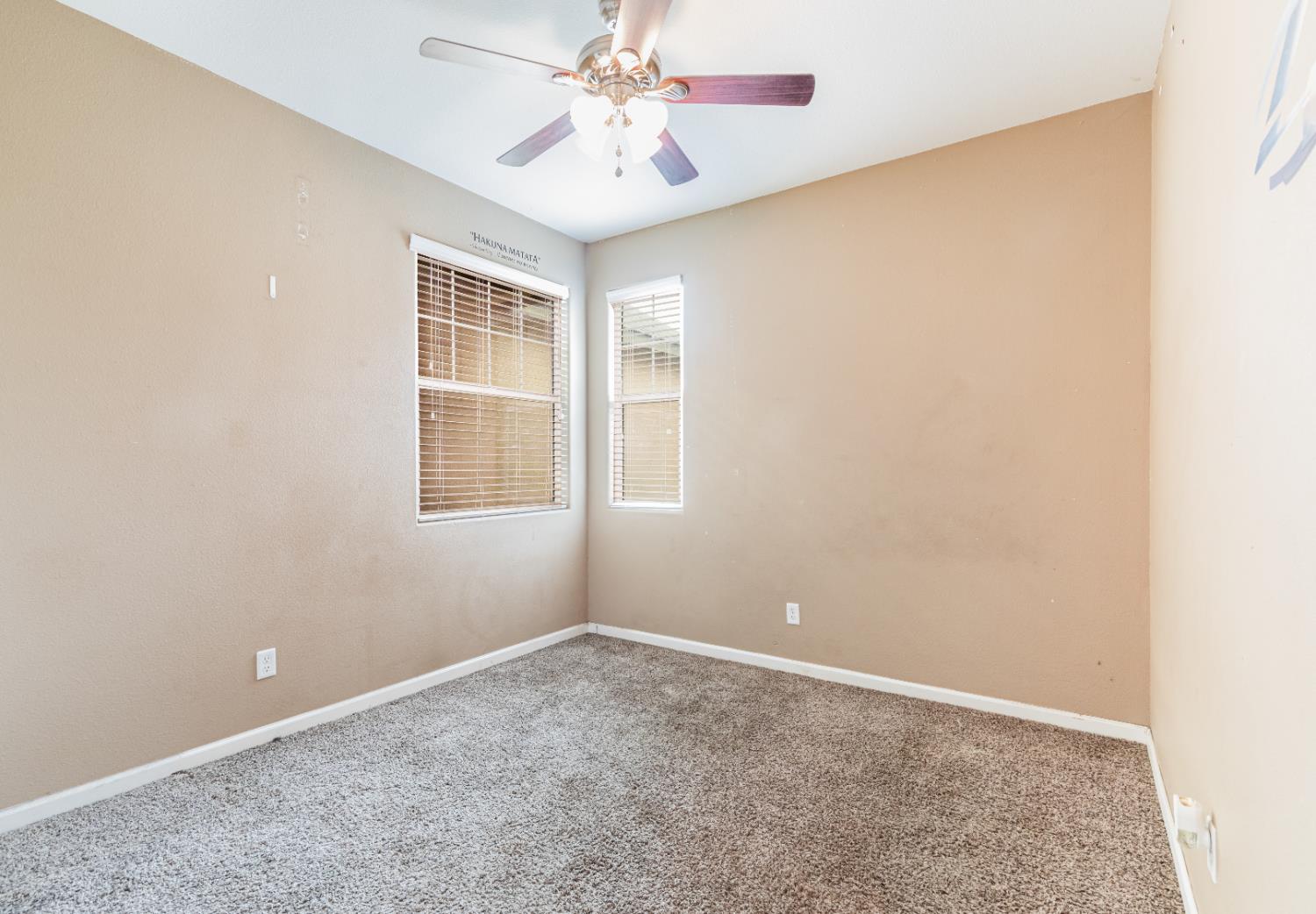 863 Legacy Drive Lemoore, CA 93245 - Photo 19 of 33 an empty room with a window and a fan