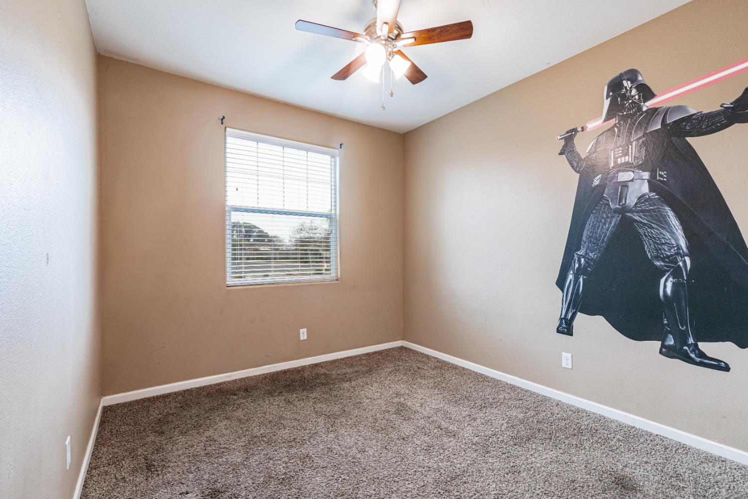 863 Legacy Drive Lemoore, CA 93245 - Photo 21 of 33 a view of a livingroom with a ceiling fan and window