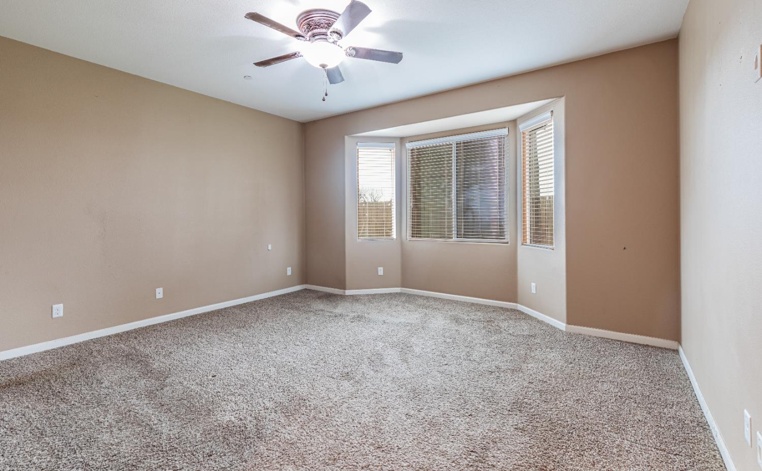 863 Legacy Drive Lemoore, CA 93245 - Photo 24 of 33 a view of an empty room with a window