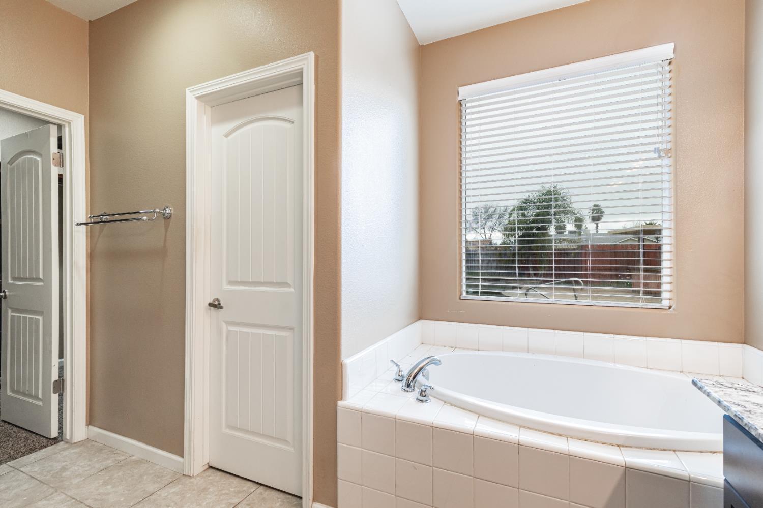863 Legacy Drive Lemoore, CA 93245 - Photo 26 of 33 a white bath tub sitting next to a window