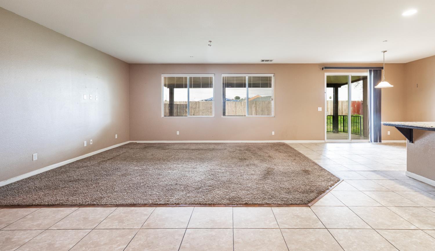 863 Legacy Drive Lemoore, CA 93245 - Photo 3 of 33 an empty room with windows