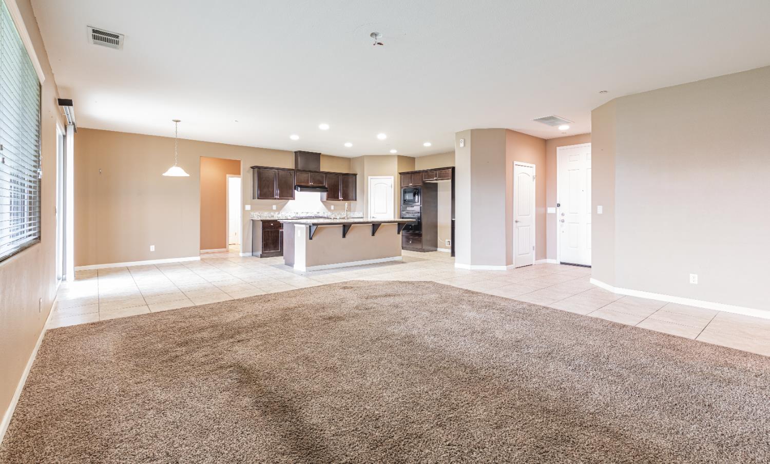 863 Legacy Drive Lemoore, CA 93245 - Photo 4 of 33 a view of a kitchen with a sink and cabinets