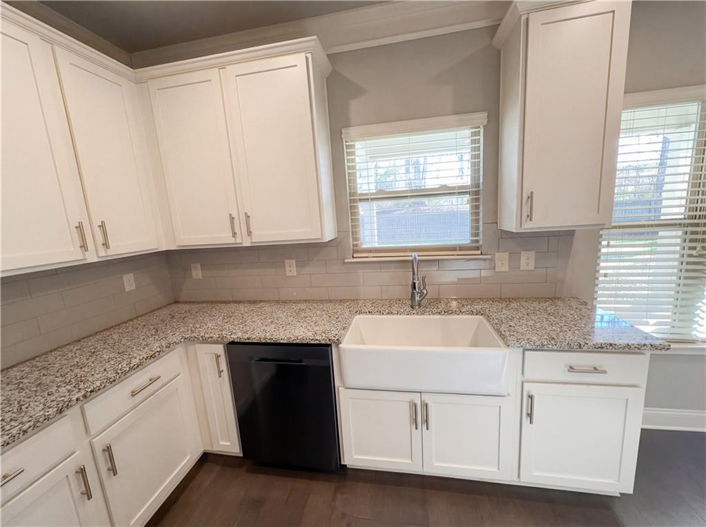 2110 George Bush Lane Jefferson, GA 30549 - Photo 12 of 40 a kitchen with granite countertop white cabinets and a sink
