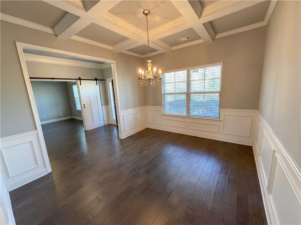 2110 George Bush Lane Jefferson, GA 30549 - Photo 15 of 40 an empty room with wooden floor and windows