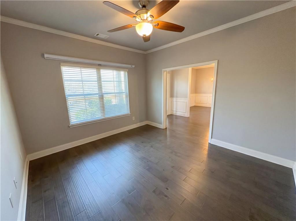 2110 George Bush Lane Jefferson, GA 30549 - Photo 19 of 40 a view of an empty room with wooden floor and a window
