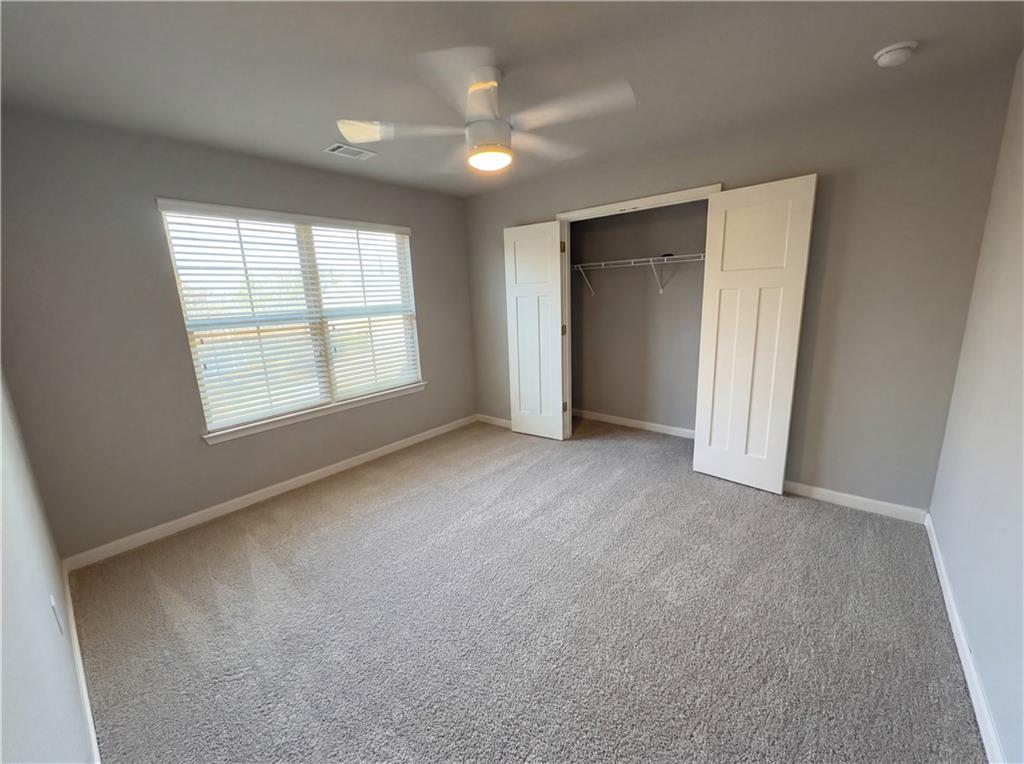 2110 George Bush Lane Jefferson, GA 30549 - Photo 26 of 40 an empty room with windows and closet
