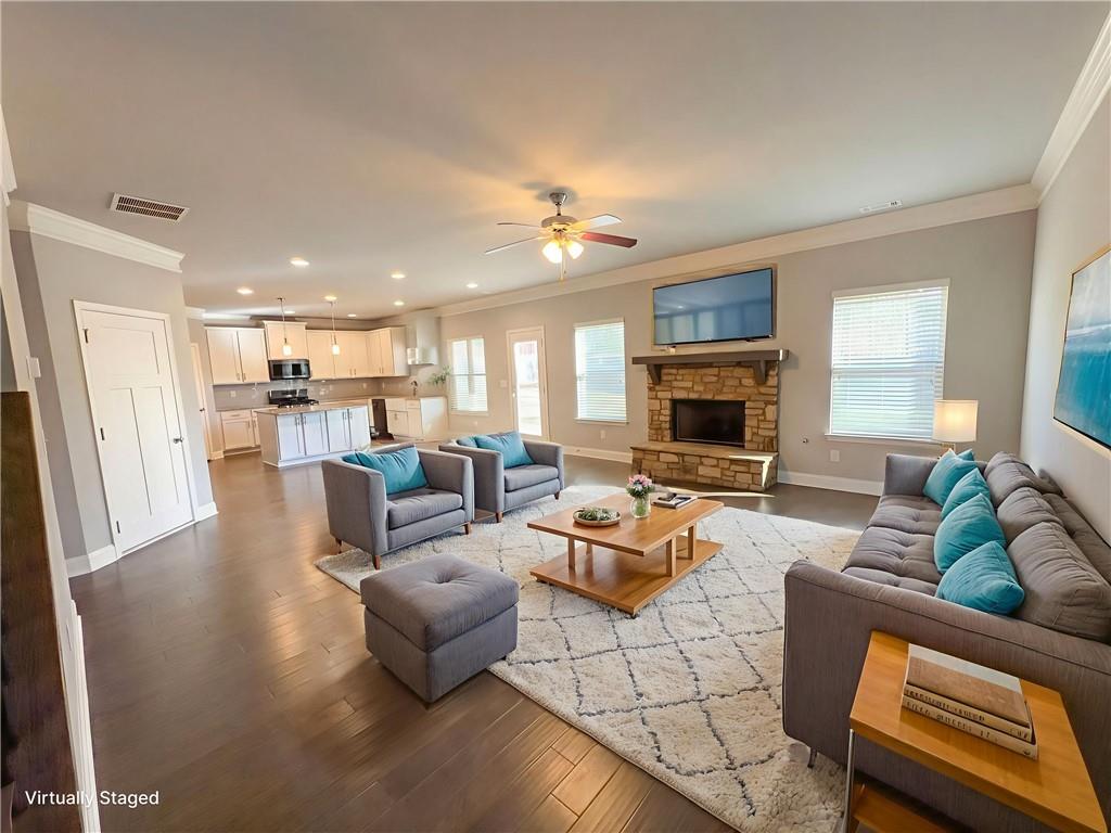 2110 George Bush Lane Jefferson, GA 30549 - Photo 4 of 40 a living room with furniture fireplace and a flat screen tv