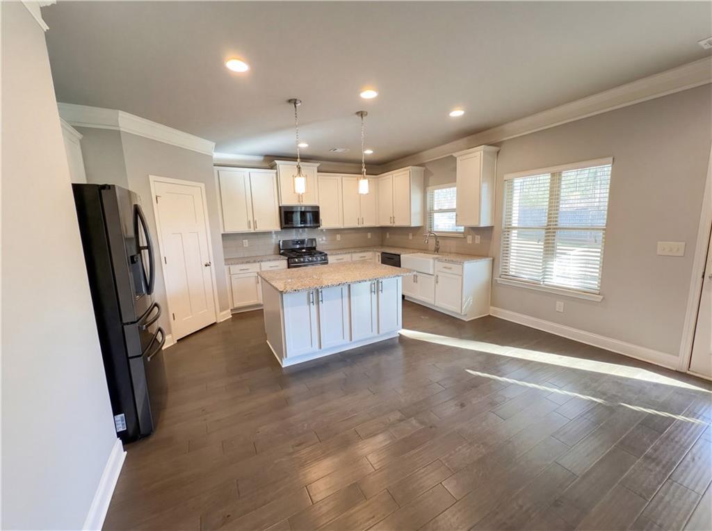 2110 George Bush Lane Jefferson, GA 30549 - Photo 8 of 40 a kitchen with a sink appliances and cabinets