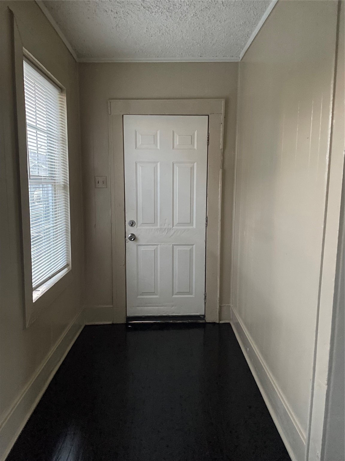 3310 Campbell Street Houston, TX 77026 - Photo 7 of 9 wooden floor in an empty room with a window