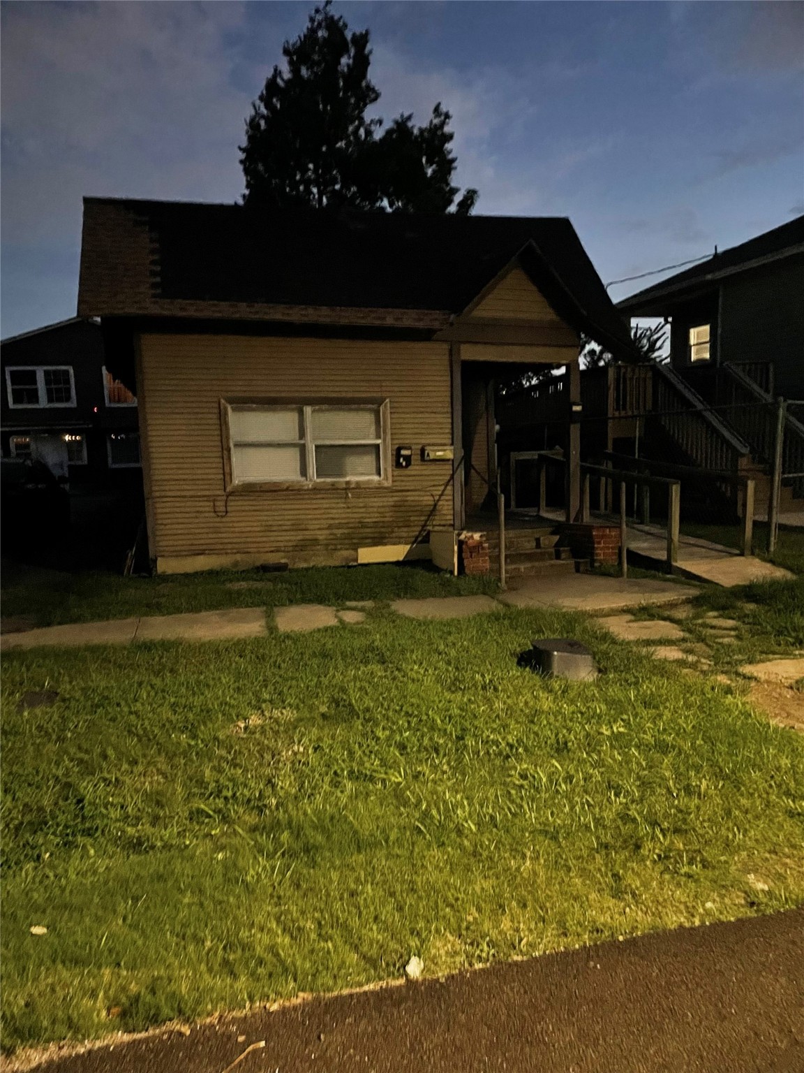3310 Campbell Street Houston, TX 77026 - Photo 9 of 9 a front view of a house with a yard