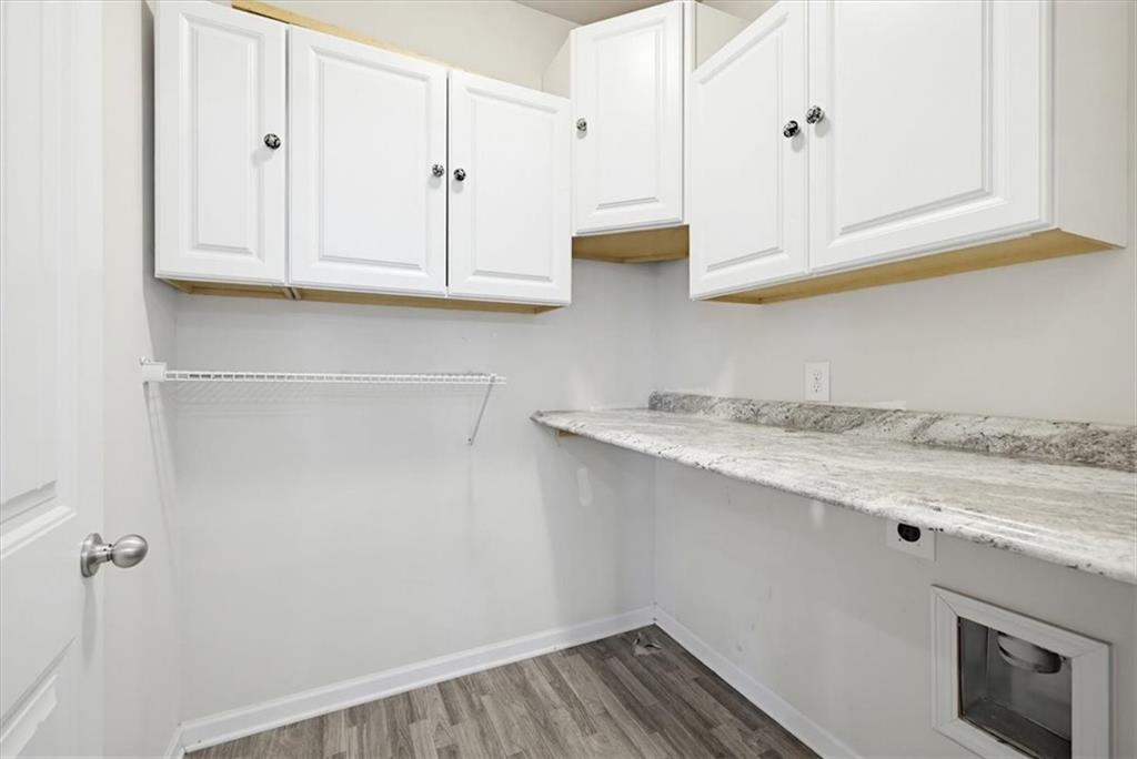 314 Boulder Run Hiram, GA 30141 - Photo 9 of 31 a view of kitchen with granite countertop white cabinets and sink