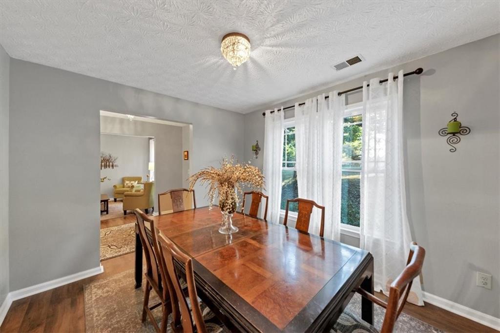 2710 Braemore Place Powder Springs, GA 30127 - Photo 11 of 53 a view of a dining room with furniture and window