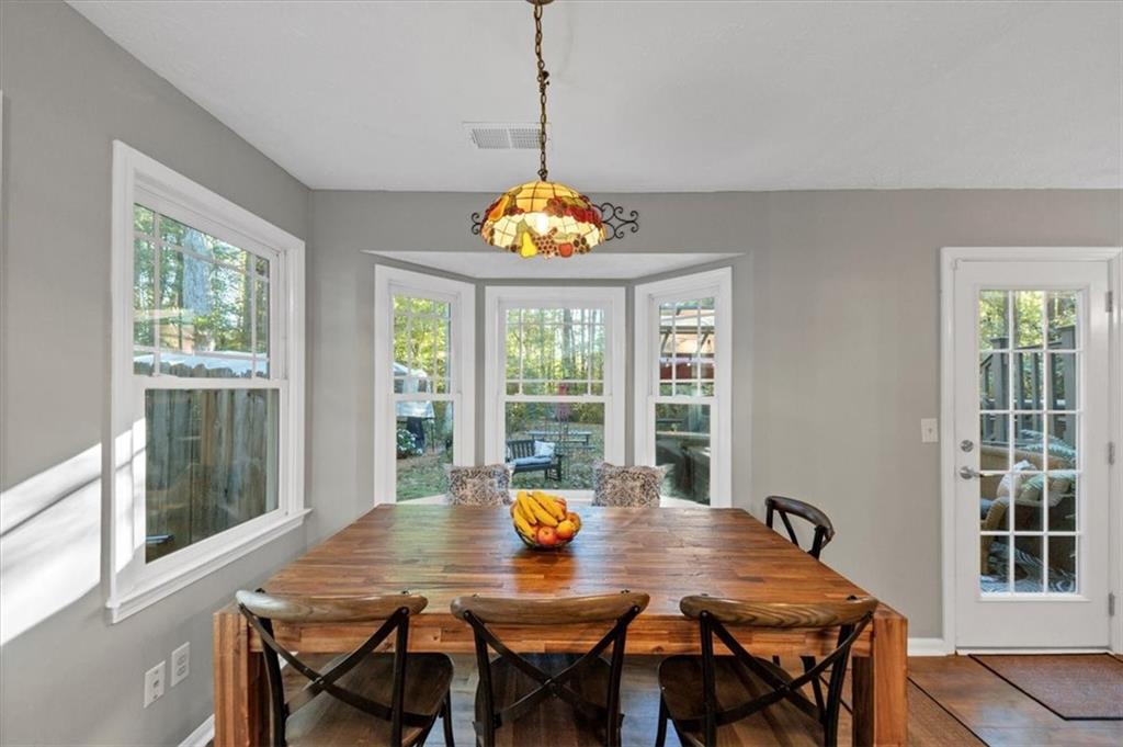 2710 Braemore Place Powder Springs, GA 30127 - Photo 16 of 53 a view of a dining room with a table and chairs