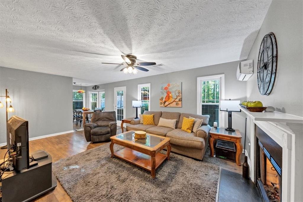 2710 Braemore Place Powder Springs, GA 30127 - Photo 22 of 53 a living room with furniture and a fireplace