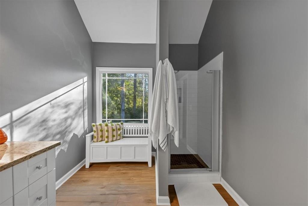 2710 Braemore Place Powder Springs, GA 30127 - Photo 37 of 53 a hallway with wooden floor and furniture