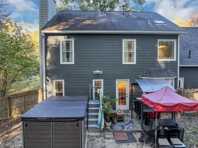a view of a backyard with plants and a patio