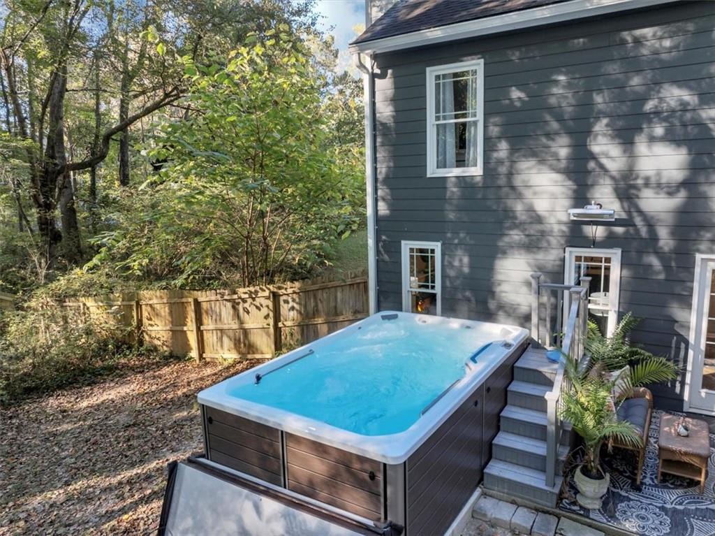 2710 Braemore Place Powder Springs, GA 30127 - Photo 44 of 53 a view of a backyard with plants and a patio