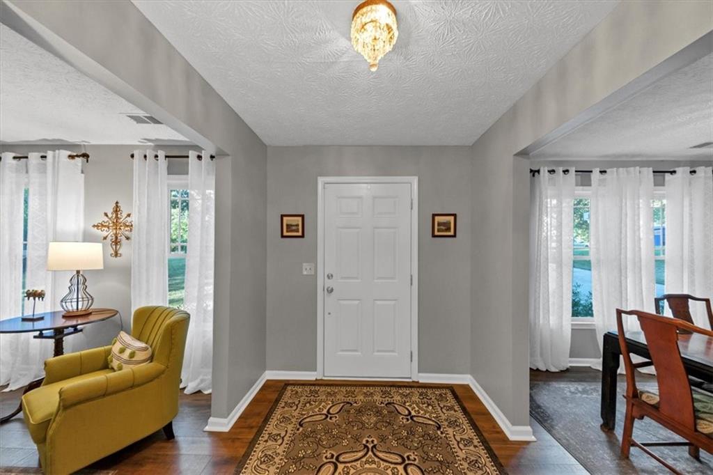2710 Braemore Place Powder Springs, GA 30127 - Photo 5 of 53 a view of a livingroom with furniture and window