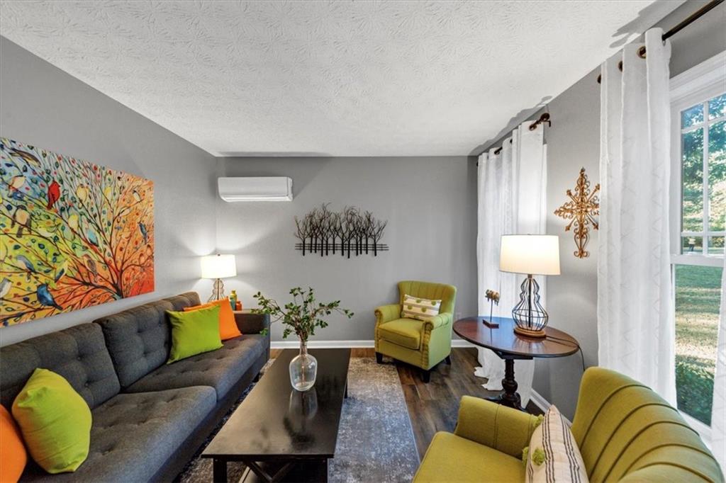 2710 Braemore Place Powder Springs, GA 30127 - Photo 7 of 53 a living room with furniture and a window