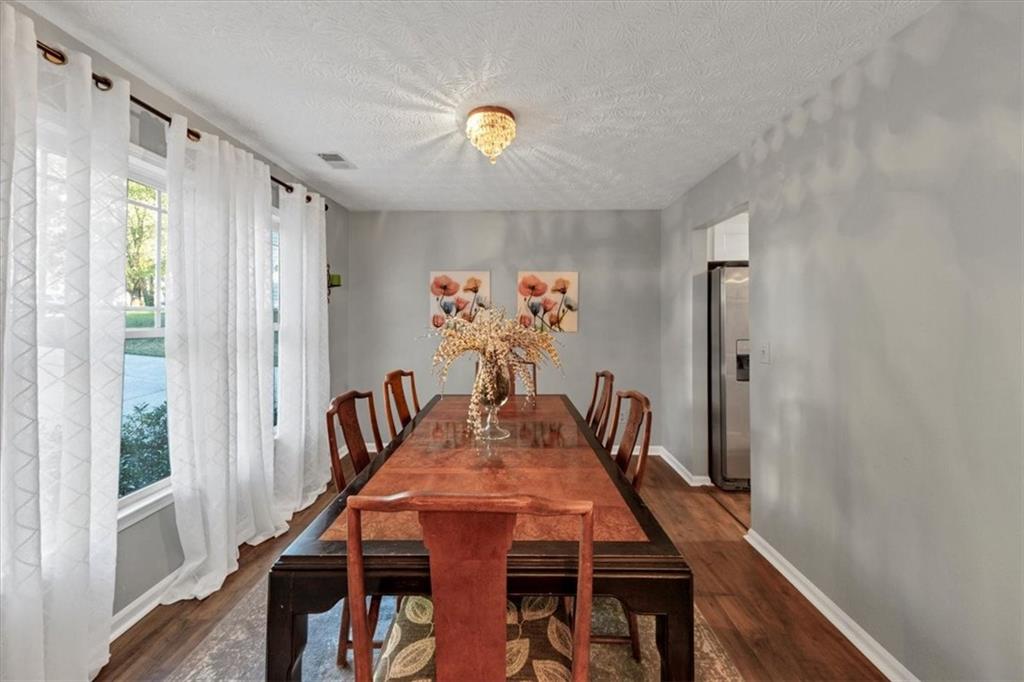 2710 Braemore Place Powder Springs, GA 30127 - Photo 10 of 53 a view of a dining room with furniture and window