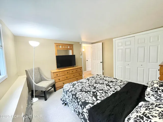 a living room with a couch and a flat screen tv