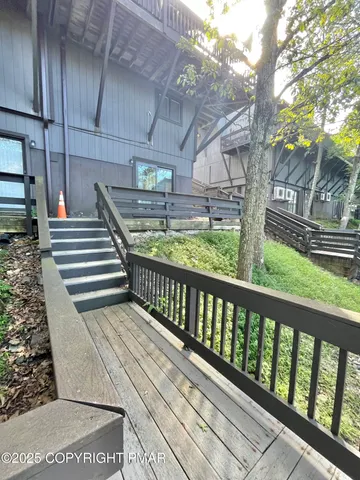 a view of balcony with wooden floor