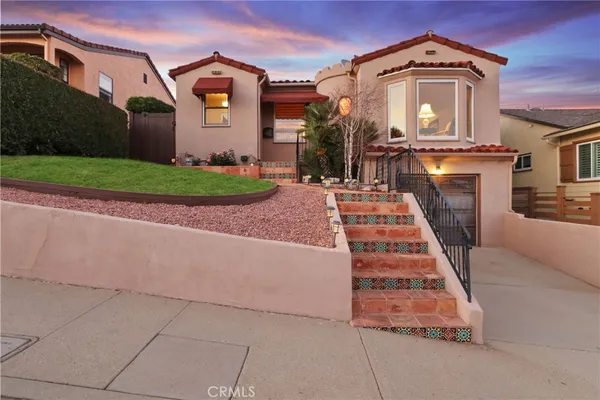 a front view of a house with yard